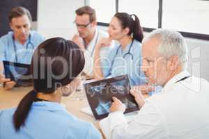 Doctors examining an x-ray report