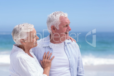 Senior couple smiling and looking away