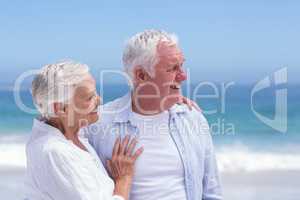 Senior couple smiling and looking away