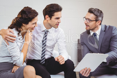 Business professional discussing with client