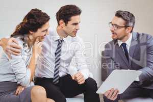 Business professional discussing with client