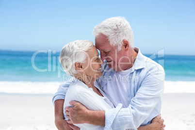 Senior couple embracing head to head