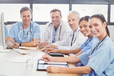 Portrait of happy medical team in conference room