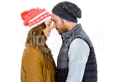 Happy young couple standing face to face