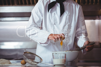 Focused chef preparing a cake