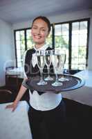Waitress with a tray of flute of champagne