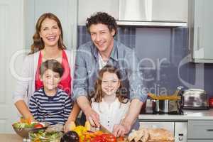 Portrait of happy family in kitchen