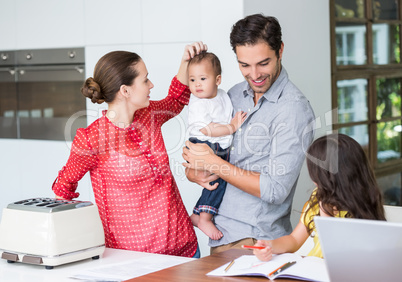 Happy family at desk