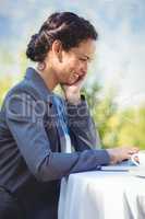 Businesswoman using laptop