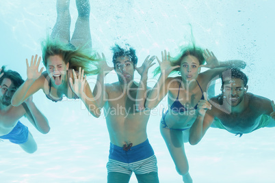Group of young friends underwater