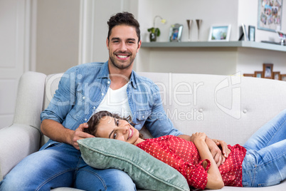Portrait of romantic couple relaxing on sofa
