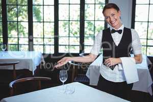 Waitress showing a table