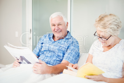 Portrait of man with wife at home