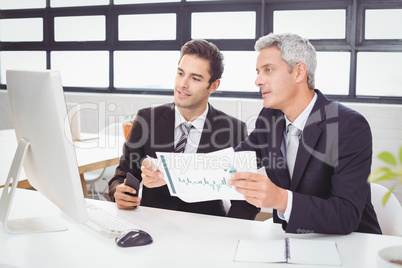 Business people working at computer desk