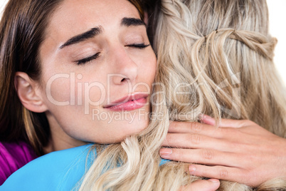 Sad woman hugging friend