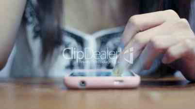Soft focused young girl browsing smartphone while smoke spreading