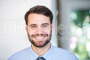 Portrait of confident businessman at home