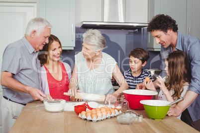 Happy family cooking food in kitchen