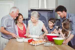 Happy family cooking food in kitchen