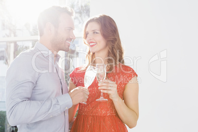 Young couple toasting glasses of champagne