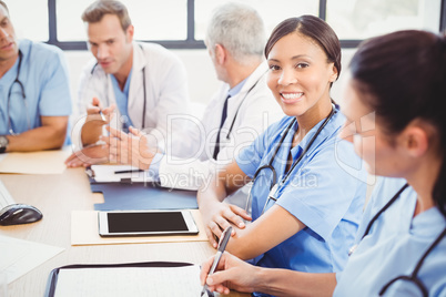 Portrait of female doctor smiling in conference room
