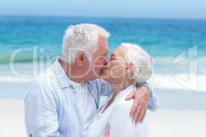 Senior couple embracing and kissing