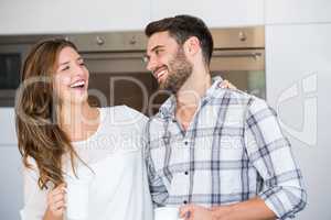 Cheerful young couple at home