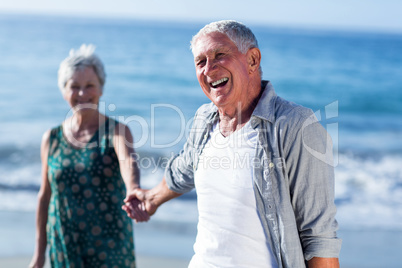 Senior couple holding hands