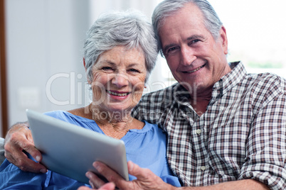 Portrait of senior couple using a digital tablet Portrait of senior couple using a digital tablet