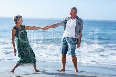 Senior couple holding hands