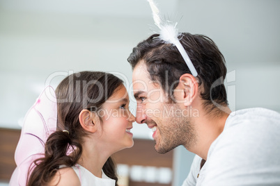 Close-up of father and daughter in fairy costume