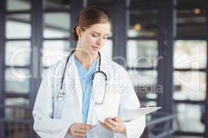 Female doctor holding clipboard