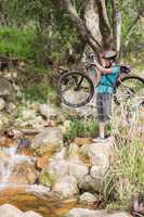 Woman carrying her bike