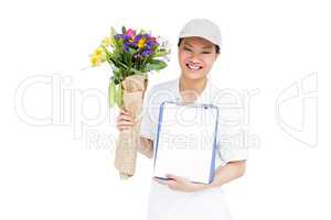Delivery woman with bouquet and clipboard