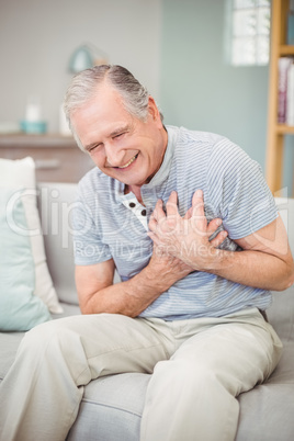 Senior man laughing at home