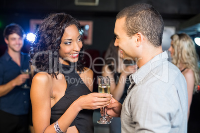 Smiling couple drinking champagne