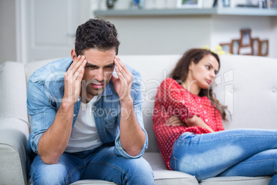 Tensed man after argument with woman