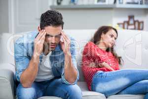 Tensed man after argument with woman