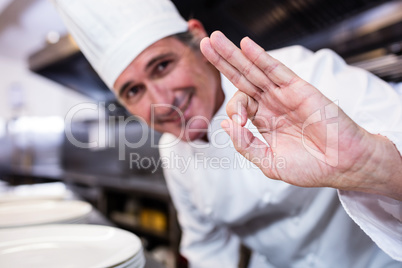 Smiling chef showing ok sign