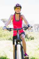 Smiling woman cycling