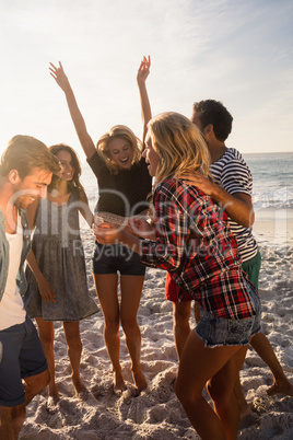 Happy friends dancing together