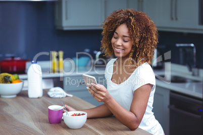 Happy woman using smartphone