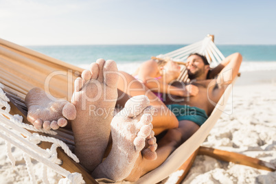 Couple lying in hammock