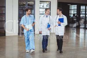 Full length of doctors discussing