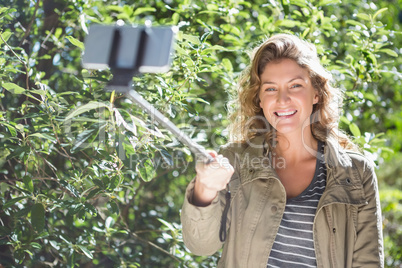 Smiling woman taking selfies