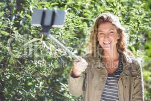 Smiling woman taking selfies