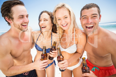 Happy friends enjoying on the beach