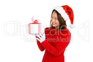 Woman in christmas attire holding gift