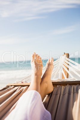 Woman lying in hammock