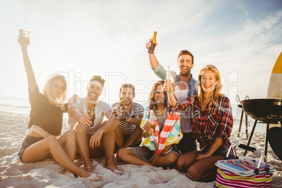 Happy friends having fun near barbecue